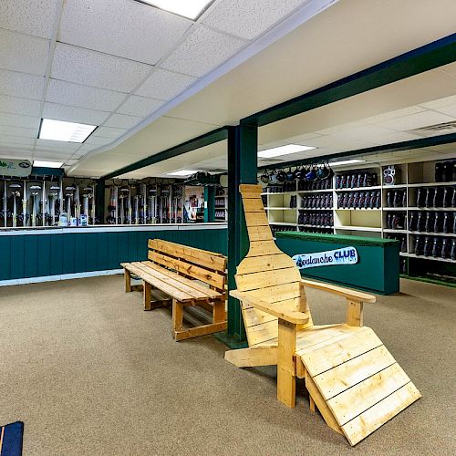 The image shows an indoor space with benches, shelves filled with ski boots, and a counter area, likely a rental shop for ski equipment at a ski resort.