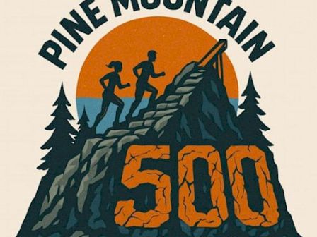 The image shows a logo with silhouettes of runners on a mountain and the text "Pine Mountain 500," surrounded by trees and a sun.