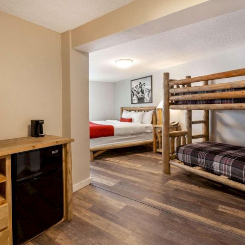 KING BED LODGE ROOM WITH BUNKBED, Sleeps up to 4. This cozy room features one king bed and a set of bunk beds